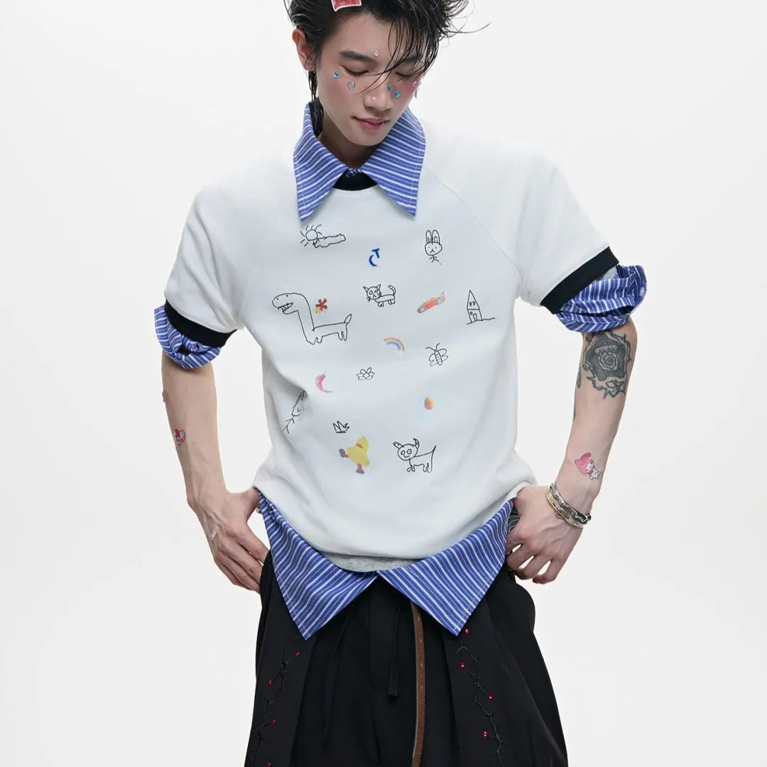 Man wearing a blue loose fit short sleeve shirt with a cartoon print design.