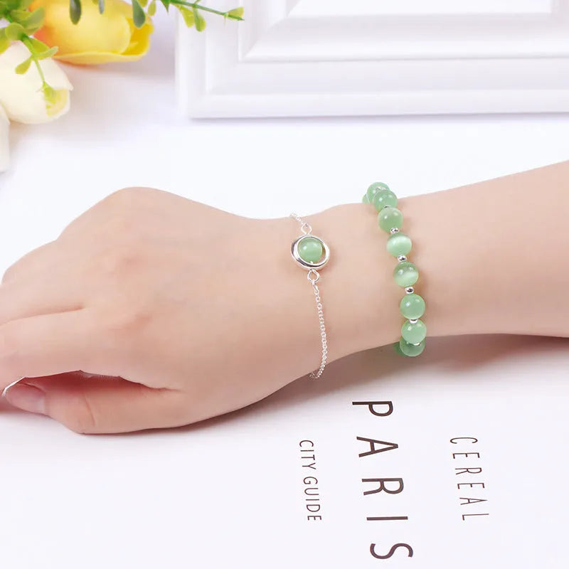 Double-layer women's bracelet with crystal beads and lucky charms in gold electroplated finish