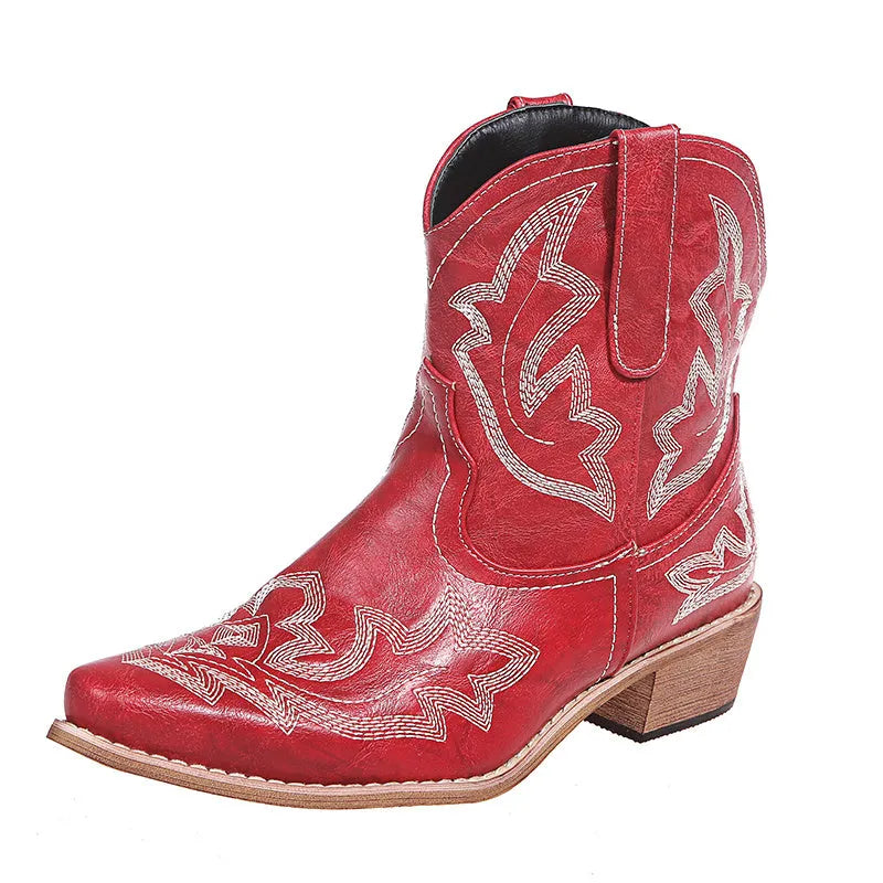 Women's blue embroidered cowboy boots with low wedge heel and pointed toe.