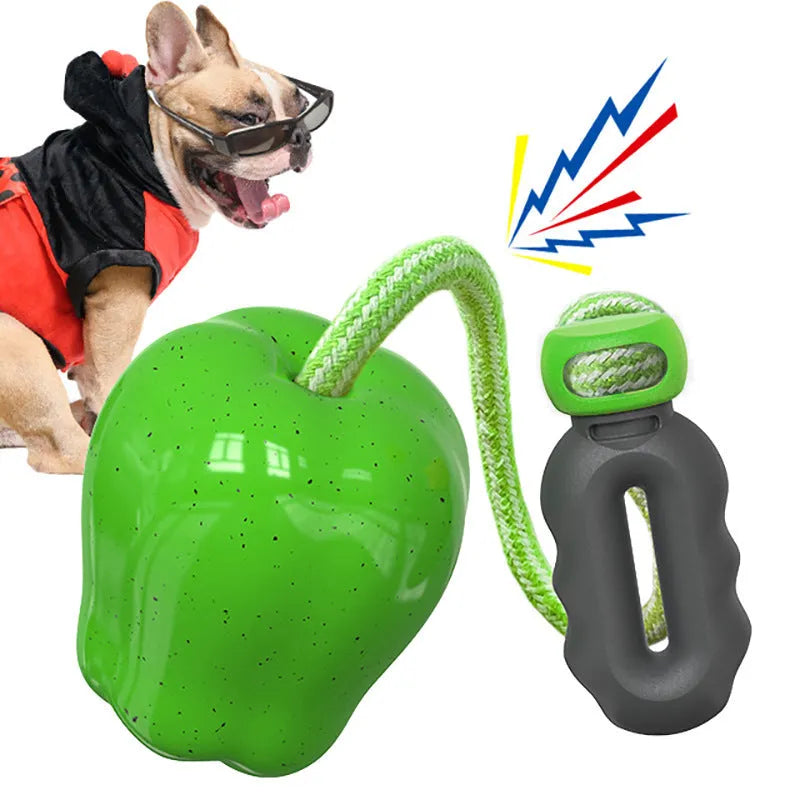 Green and red Apple-shaped dog molar toy with food-dropping ball design for outdoor canine enrichment