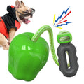 Green and red Apple-shaped dog molar toy with food-dropping ball design for outdoor canine enrichment