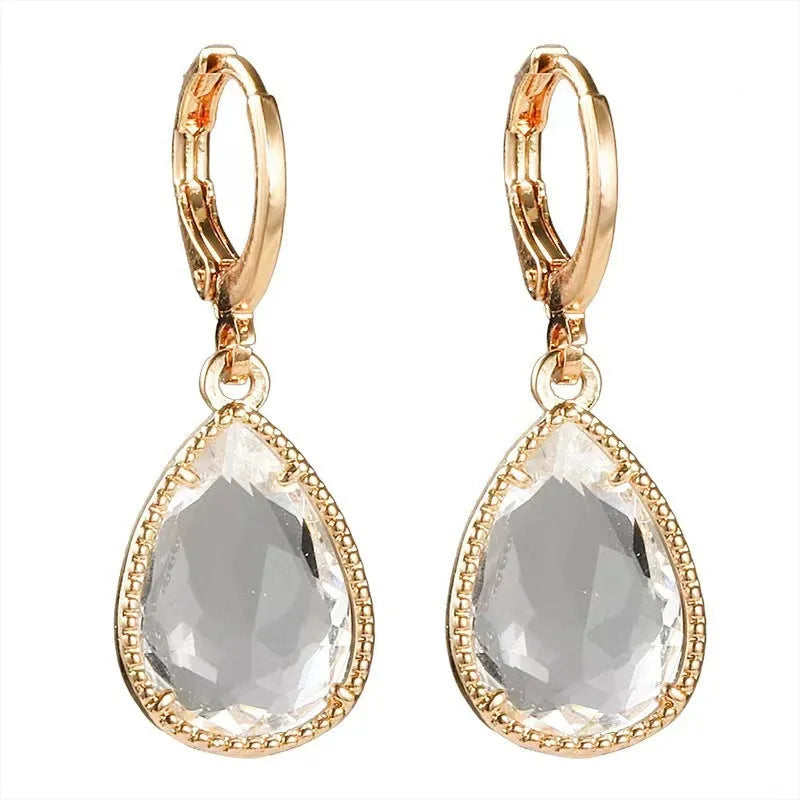 Copper-coloured rare earth metal and glass geometric saturn water drop earrings in multiple colours.