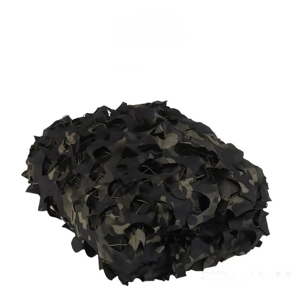Green camouflage net set on grass showing textured pattern for sunshade and concealment.
