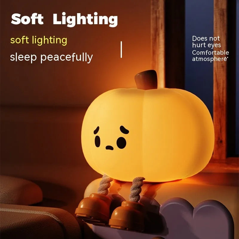 Soft silicone pumpkin night light with touch dimming controls and USB charging port