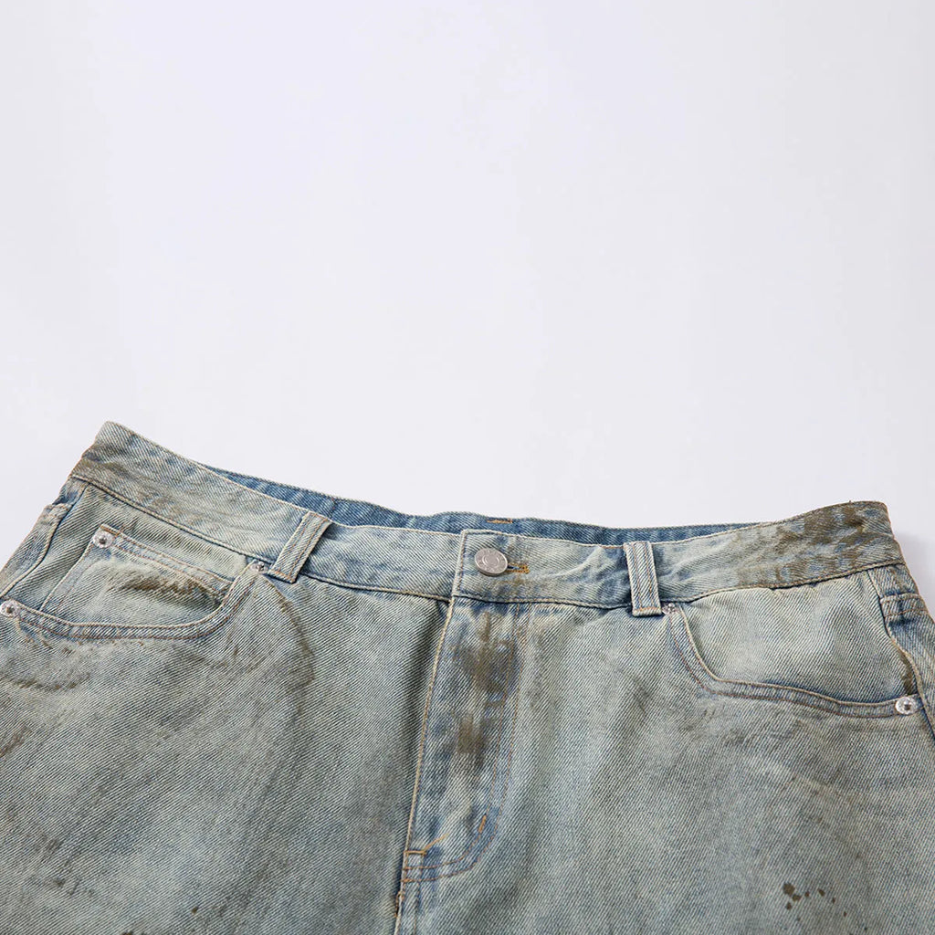 Blue cropped denim trousers with a straight leg and zip fly on a hanger