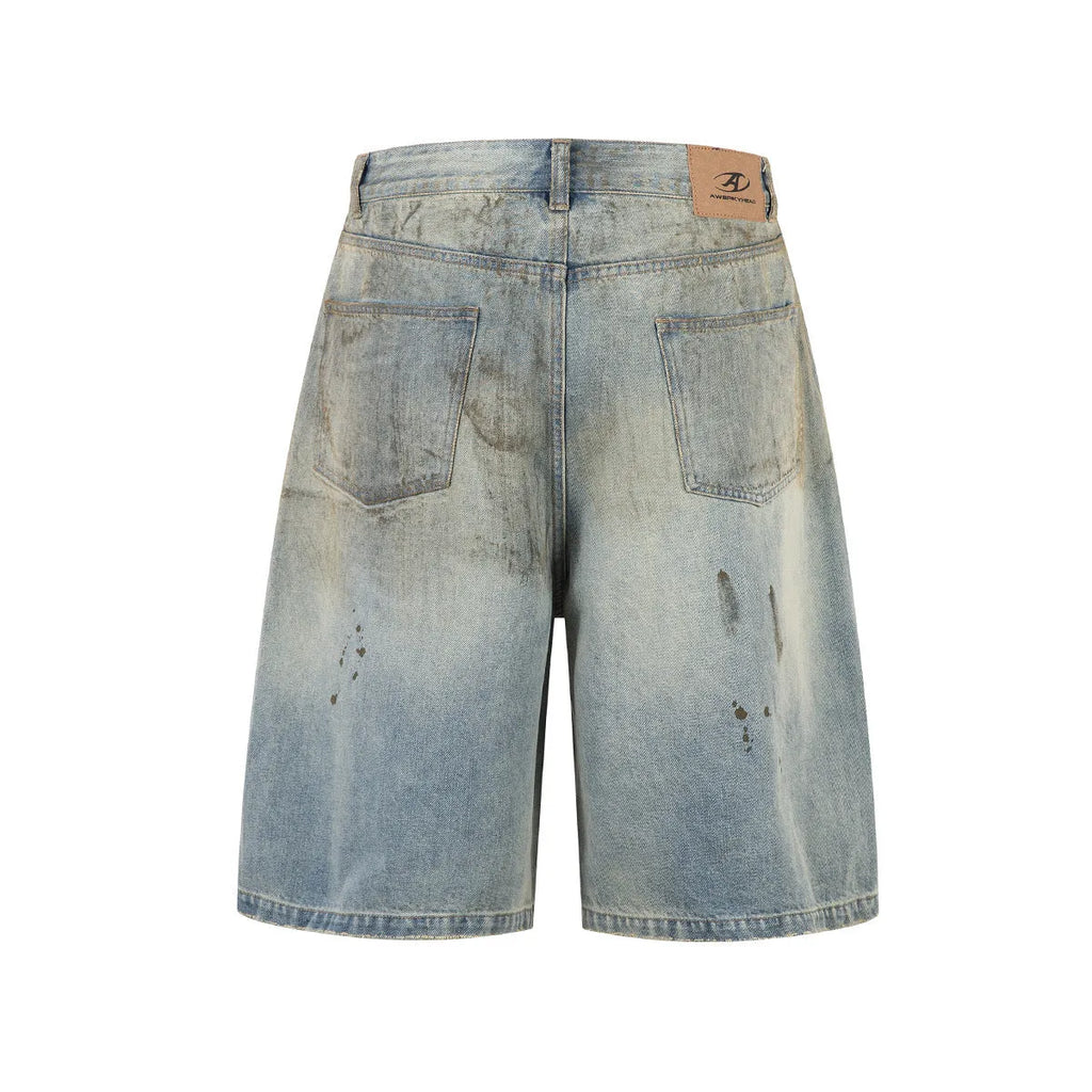 Blue cropped denim trousers with a straight leg and zip fly on a hanger