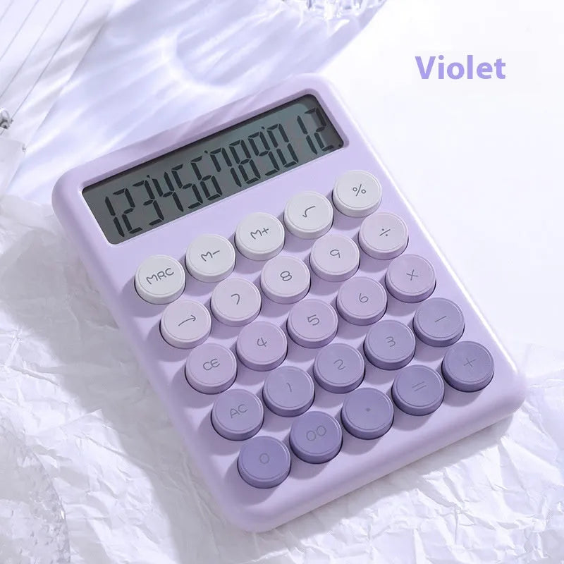 Gradient colour desktop calculator in violet, pink, blue, or green on a desk.
