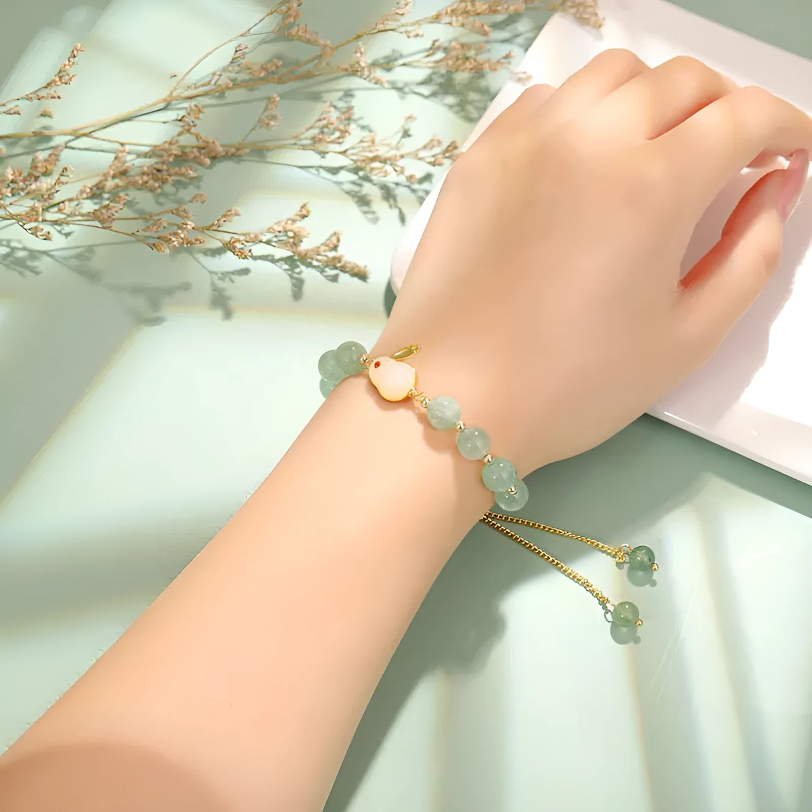 Adjustable rabbit charm bracelet with green aventurine or strawberry quartz stone beads and gold accents