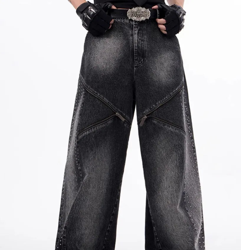 Black and grey washed wide leg cotton denim trousers and matching waistcoat set laid flat.