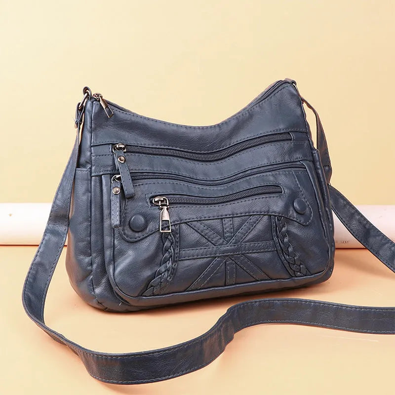 Soft PU casual messenger bag with multi-layer multi-pocket design in black colour