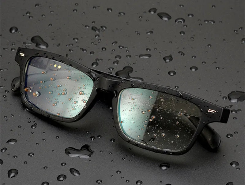 Unisex Bluetooth compatible smart glasses with open-ear design on a glasses case, with USB cable.