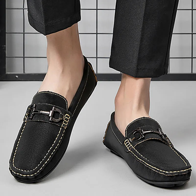 Men's beige leather casual loafers with a round toe and rubber sole.