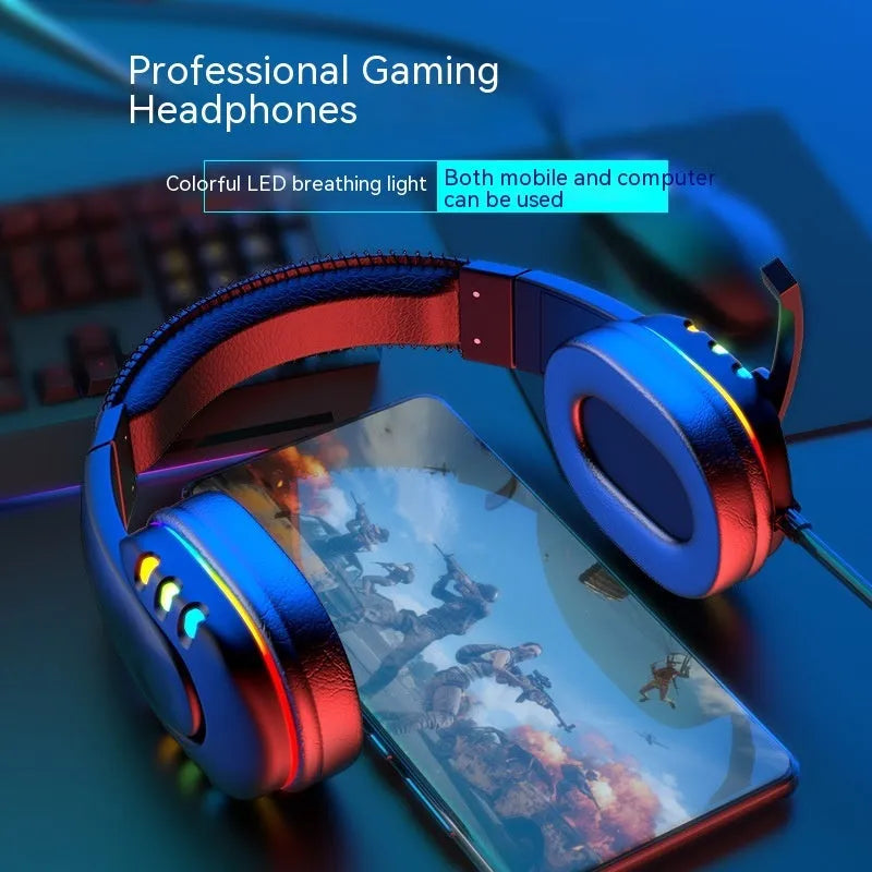 Black Colourful gaming headset with LED breathing light, sponge ear cushions, nylon cable, and omnidirectional microphone on a desk