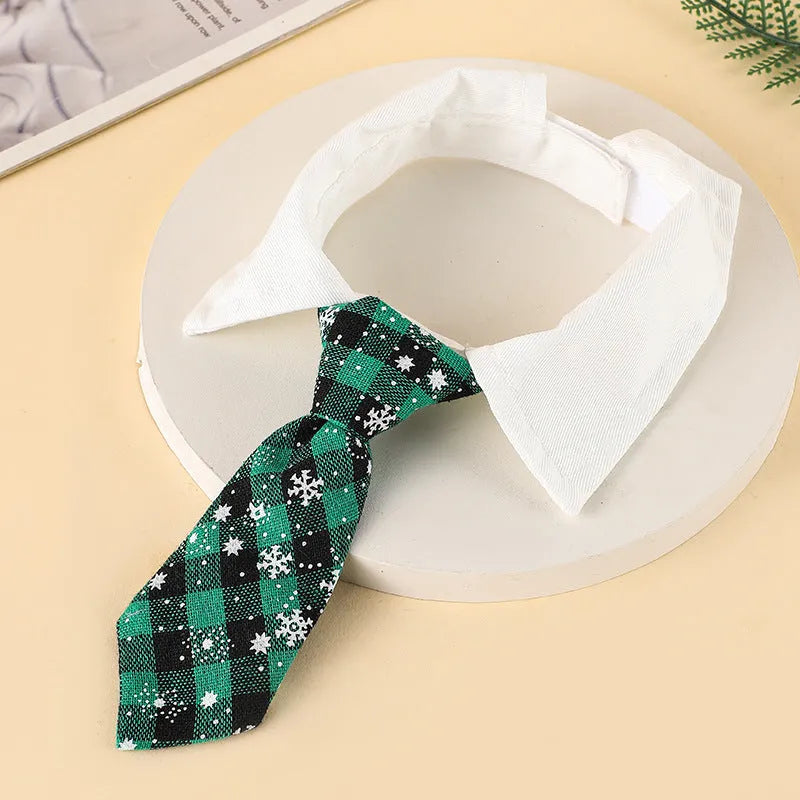 Christmas dog necktie with red plaid snowflake pattern on a small dog for festive wear