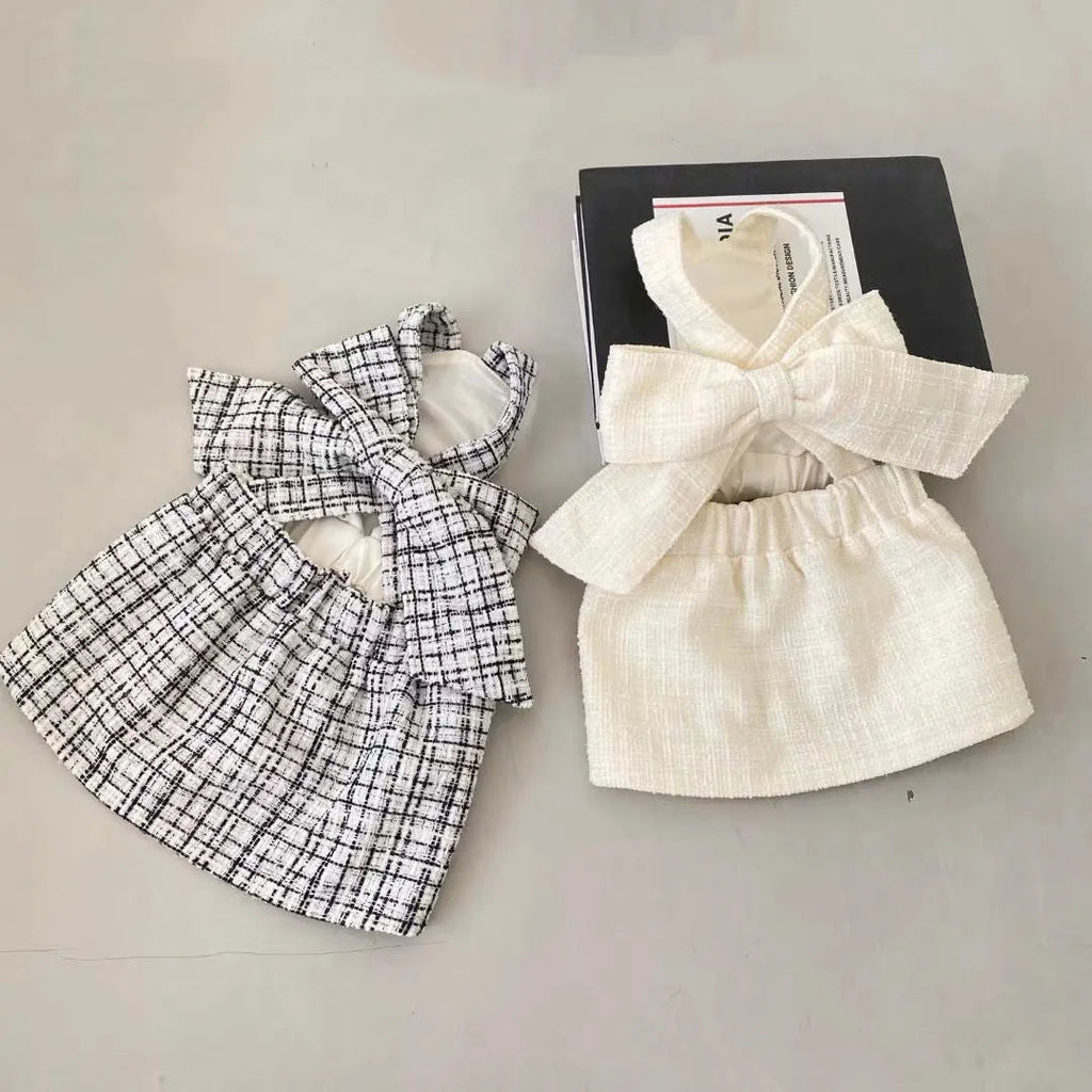 Cotton sling skirt dog pet clothing in black and white pattern on a small dog