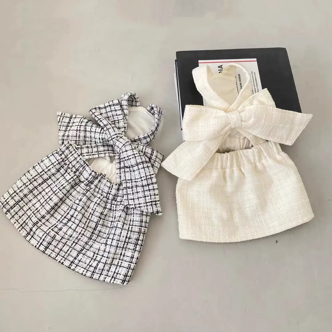 Cotton sling skirt dog pet clothing in black and white pattern on a small dog