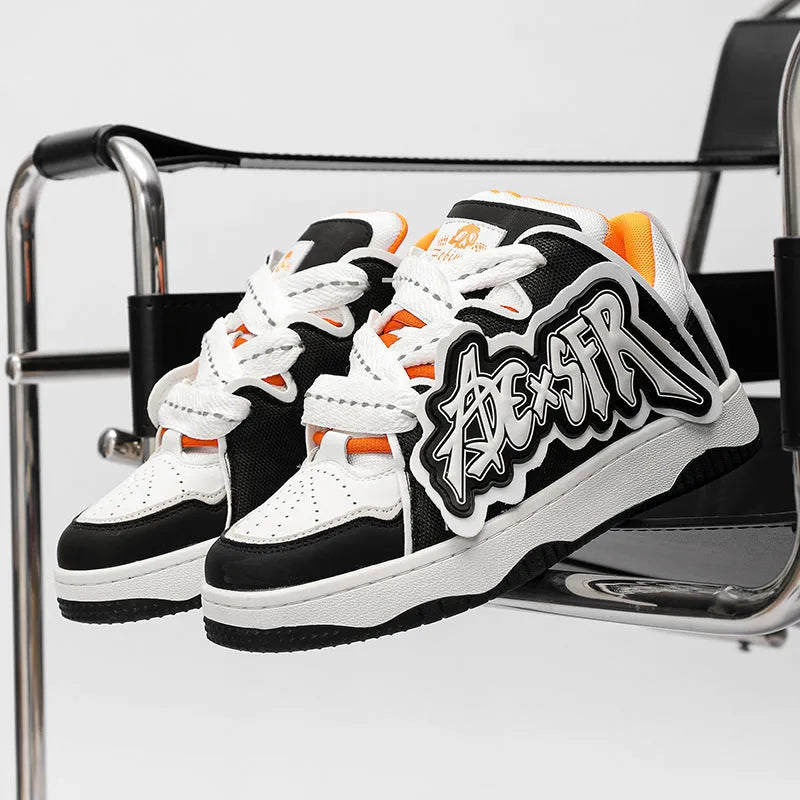 Low-top canvas skate shoes with front lacing, mesh lining, PU insole and rubber sole in white and black, black and red or sky