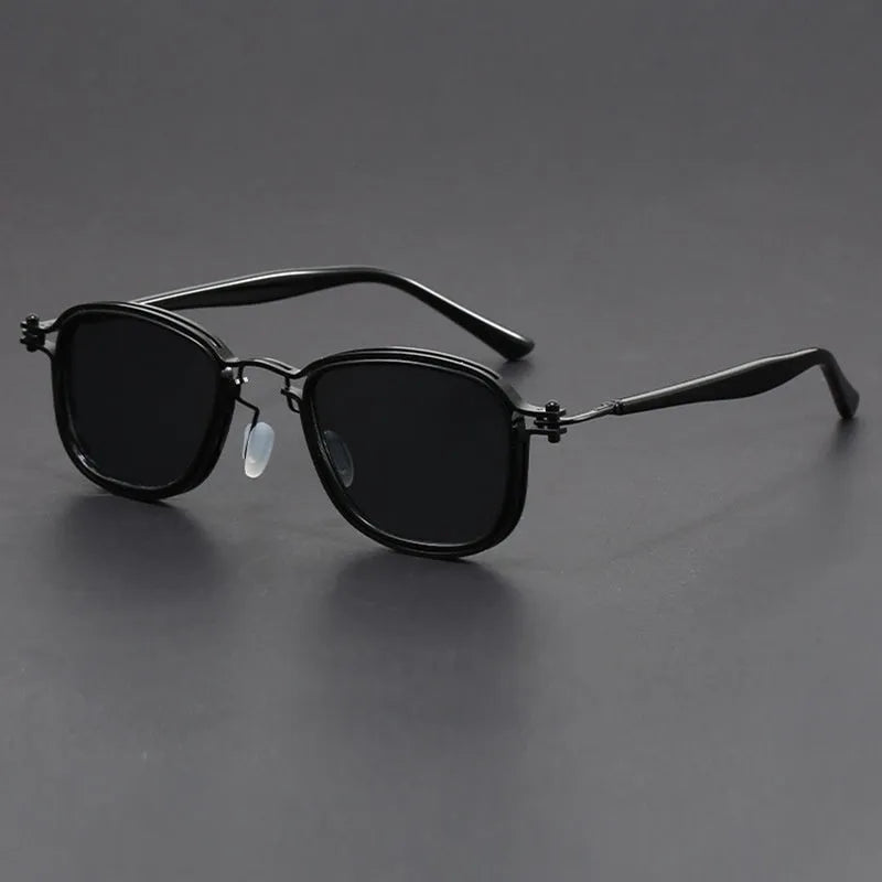 Retro square sunglasses with metal decorative patterns and tinted lenses in a two-tone colour finish.