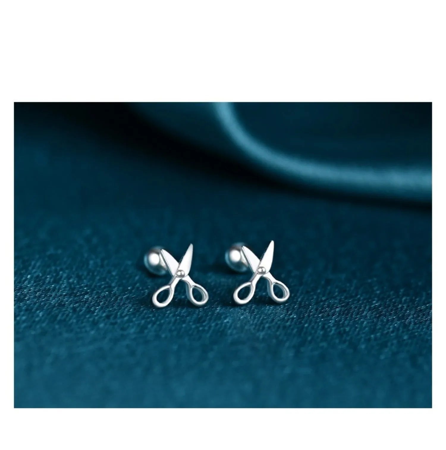 Silver ear nails with screw back closure and mini scissors decorative screw detail