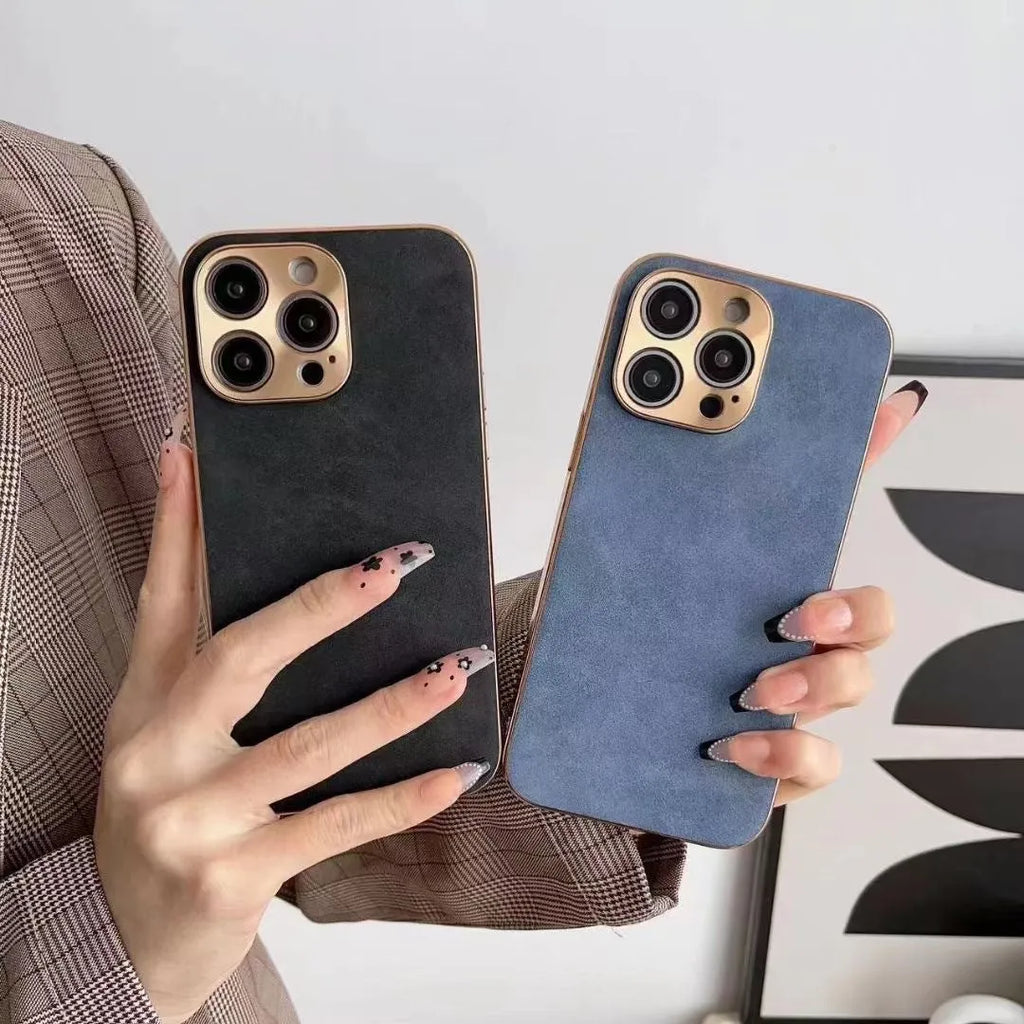 Leather texture TPU phone case for iPhone on a table, showing grey-green colour and precise camera cutouts.