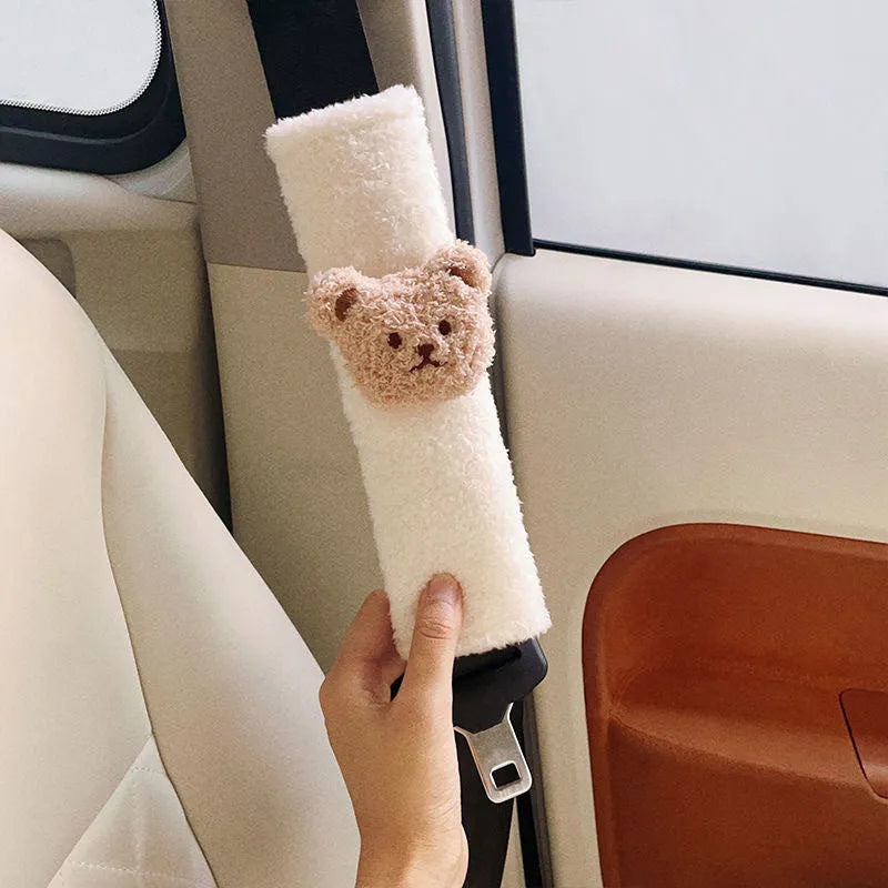 Cartoon bear plush seat belt cover for baby car seats showing khaki and coffee colour options