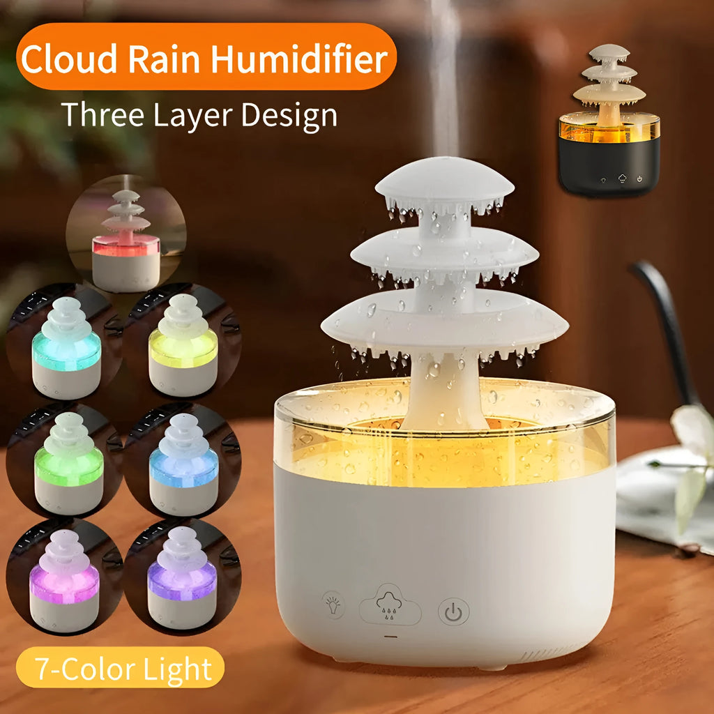 White cloud rain design ultrasonic air humidifier and essential oil diffuser with colourful LED lights on a table.