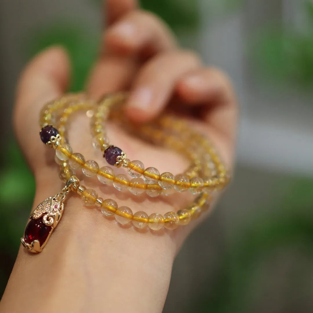 Natural Brazil gold rutilated quartz bracelet with Chinese style design and three gold rings