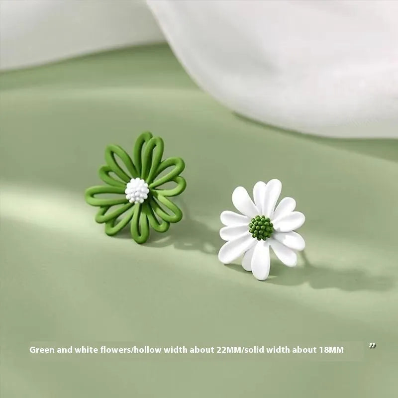 Close-up of colourful cartoon flower stud earrings in alloy on a white background.