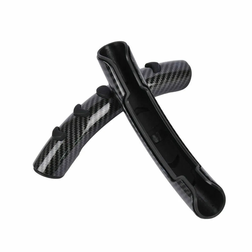 Carbon fibre black anti-slip sleeve fitted on a car steering wheel.
