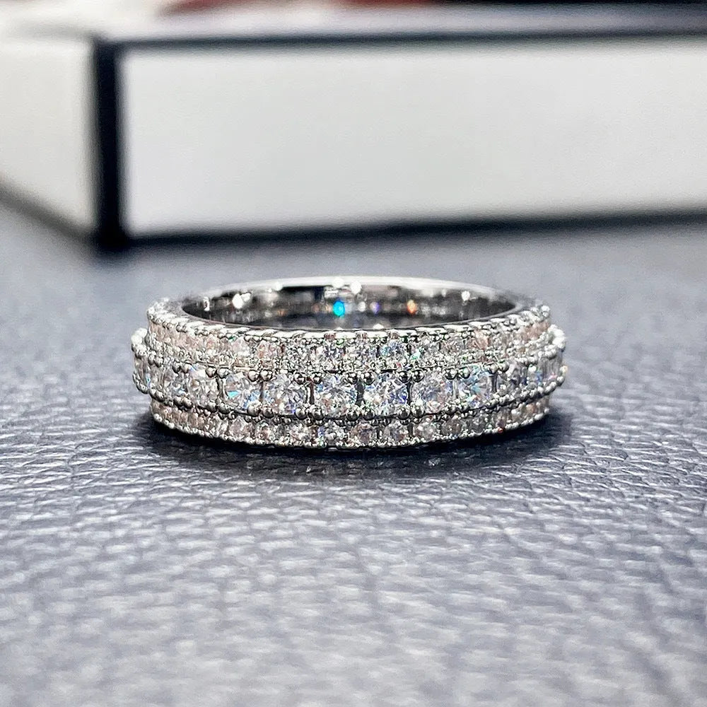 Geometric triangle ring with a zircon stone in a copper band, shown in white gold finish.