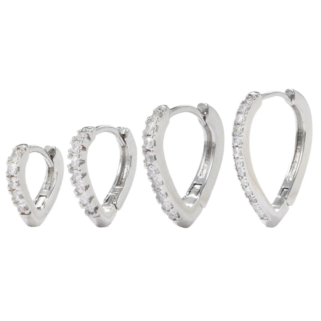 Geometrical heart-shaped gold and white gold electroplated copper ear clip for women.