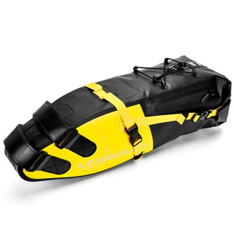 Yellow waterproof PVC bicycle tail bag mounted on a rear bike rack, showing roll-top closure and adjustable straps.