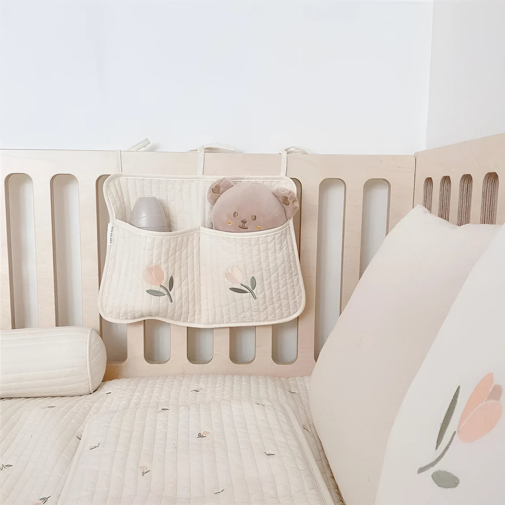 Cotton cloth hanging storage bag for baby bottles and diapers, available in six colours including bear, olive, and tulip