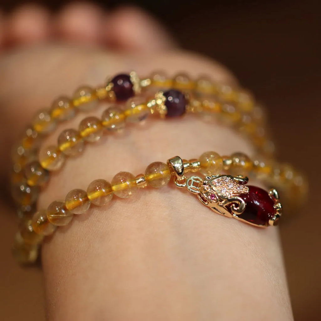 Natural Brazil gold rutilated quartz bracelet with Chinese style design and three gold rings