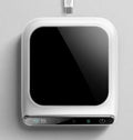 Black mini USB cup warmer with heating coaster on a desk