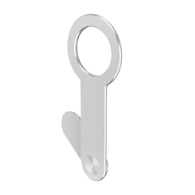 Metallic silver aluminium alloy mobile phone holder for Apple iPhone on a desk