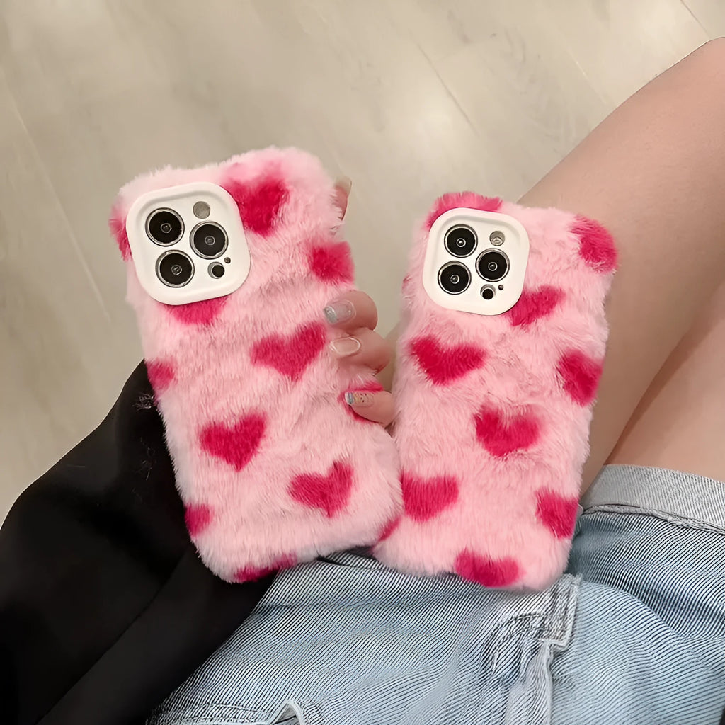 Pink silicone phone case with cartoon design for iPhone models 12, 13, 14, and 15.