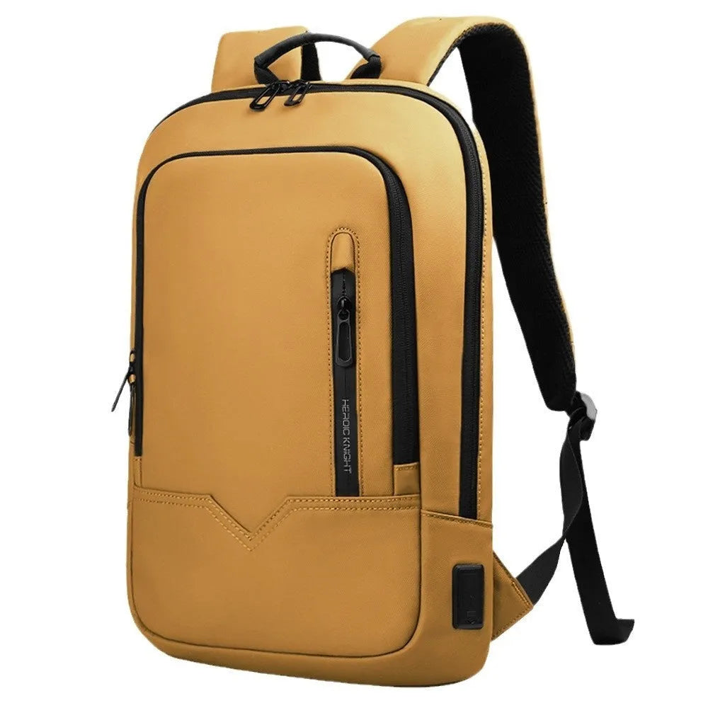 Lightweight solid-colour polyester laptop backpack showing external USB charging port.