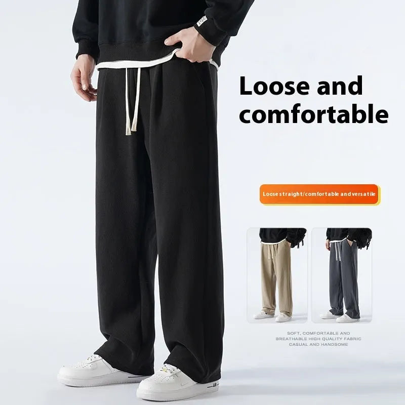 Men's apricot fleece-lined casual sports trousers with a loose fit and drawstring waist, laid flat.
