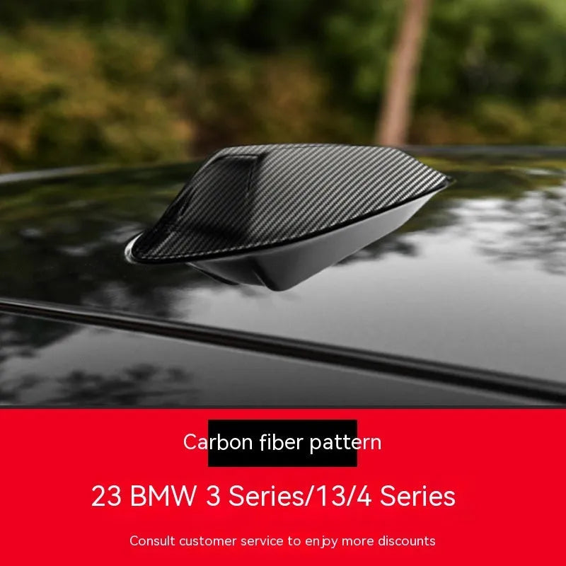 BMW shark fin antenna cover in carbon fibre and piano black finishes for Types A, B, and E.