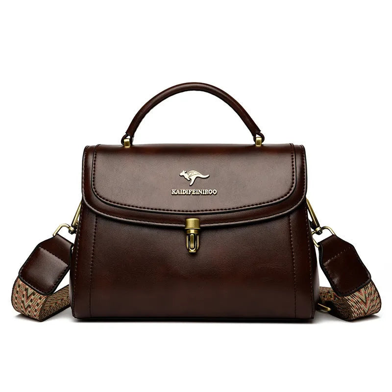 Women's textured PU crossbody handbag in horizontal square shape with rear pocket, black colour