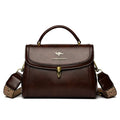Women's textured PU crossbody handbag in horizontal square shape with rear pocket, black colour