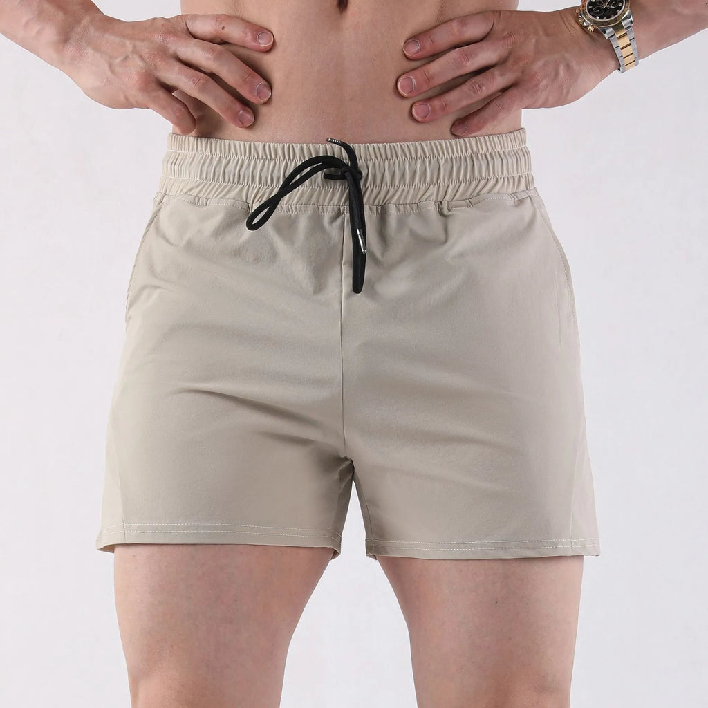 Men's thin grey polyester basketball shorts with elastic waistband, shown front view.
