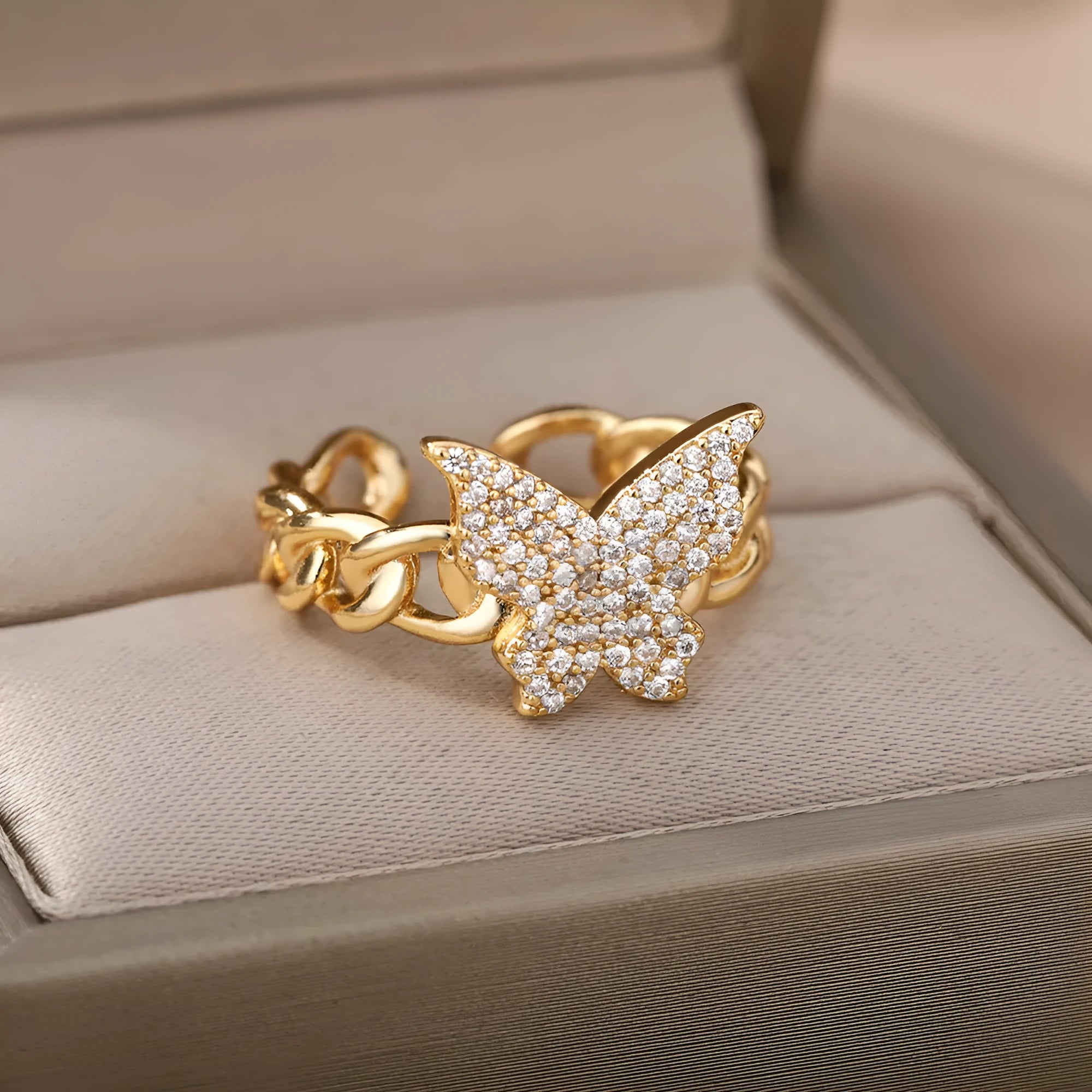 Personality zircon butterfly ring with three-dimensional design in gold tone on a white background