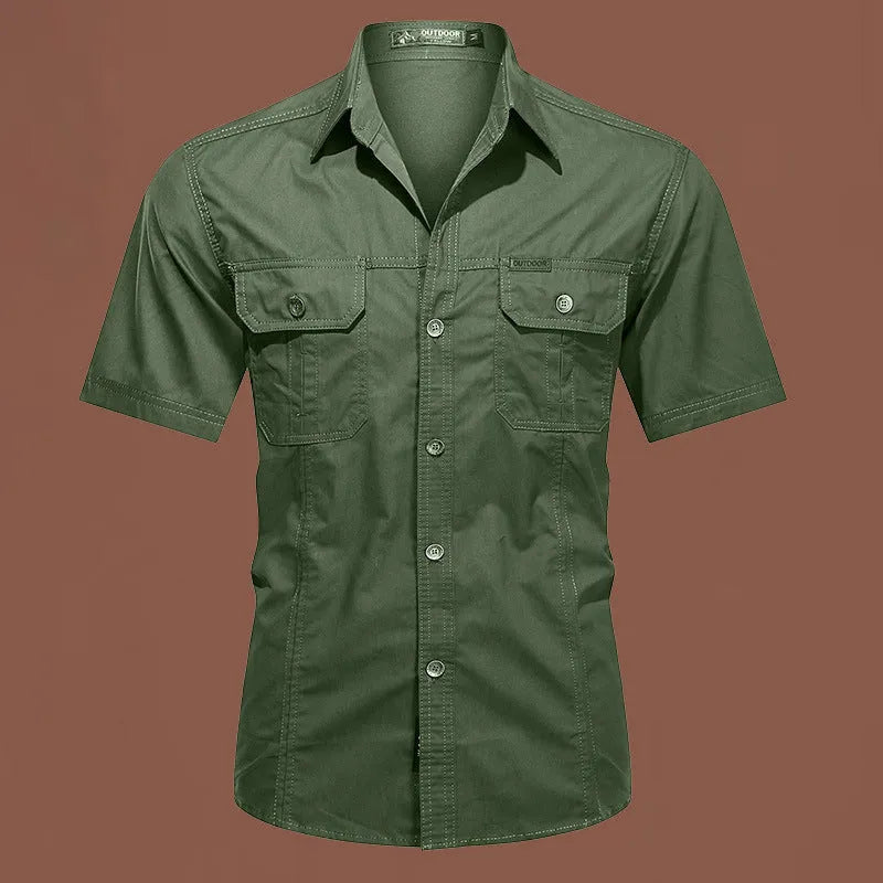 Man wearing a beige cotton short sleeve work shirt with a cardigan style and loose fit.