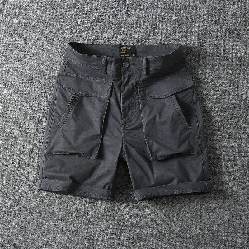 Men's beige cotton cargo shorts with multiple pockets on a straight-leg fit, shown on a neutral background.