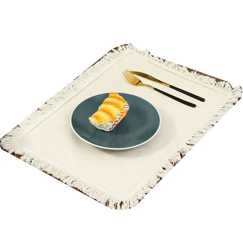 Solid colour square polyester placemat on table in beige colour