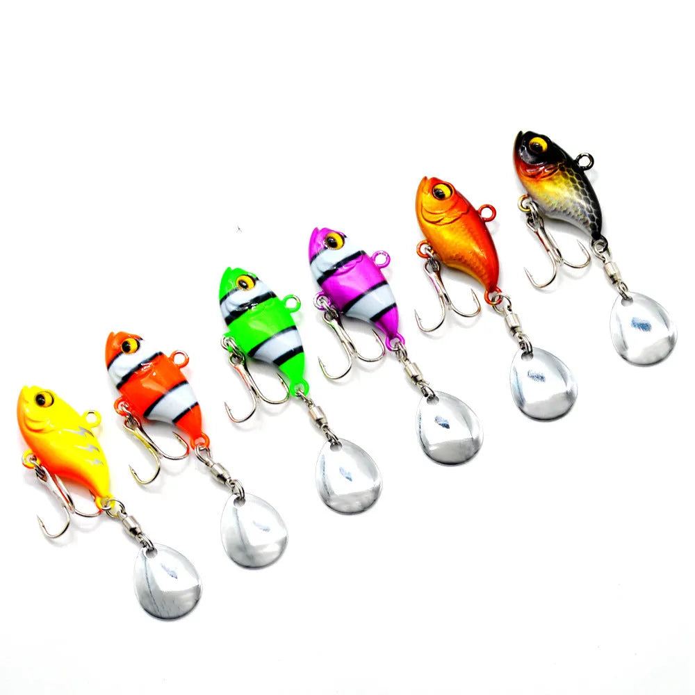 Gold metal fishing spinnerbait lure with a rotating sequin plate on a hook.