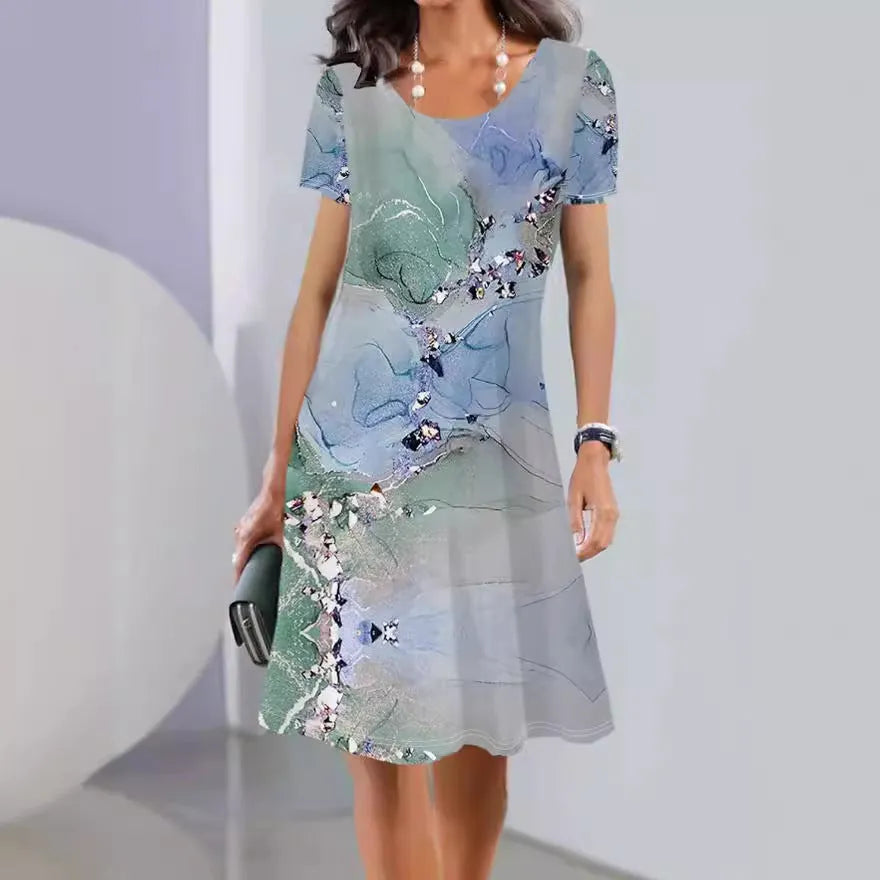 Women's floral print summer dress with short sleeves and an A-line midi skirt on a hanger.