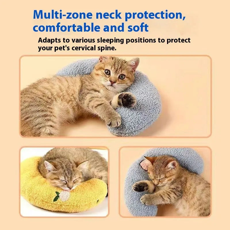 Blue U-shaped cloth pillow for cats on a wooden floor, showing its head-cradling design.